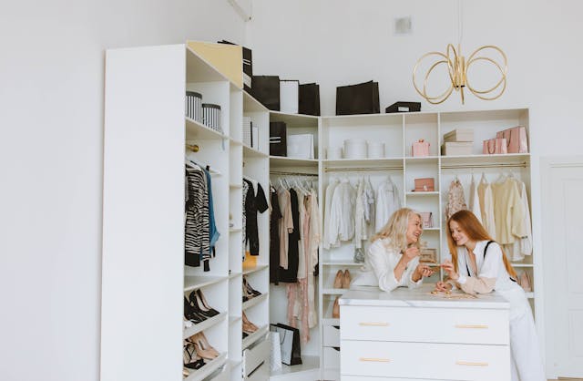 people standing in a walk-in closet