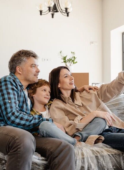 a family moving into their new home and thinking about eco-friendly design tips for a sustainable home transformation