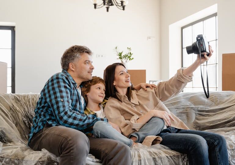 a family moving into their new home and thinking about eco-friendly design tips for a sustainable home transformation
