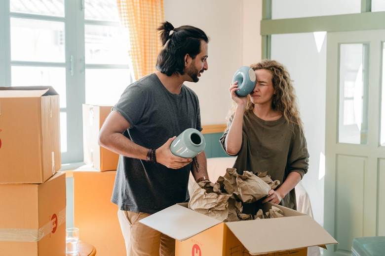 couple unboxing decorations together